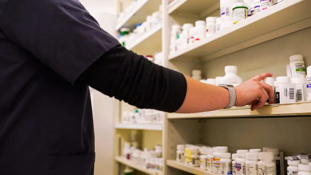 Stocked shelves inside Economy Pharmacy with vitamins and over-the-counter products