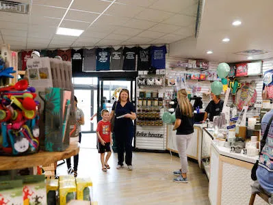 A family visiting the counter at Economy Pharmacy Muskogee Westside